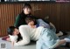 A group of three young women laying on the floor.