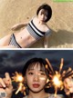 A woman in a striped bikini holding a sparkler.